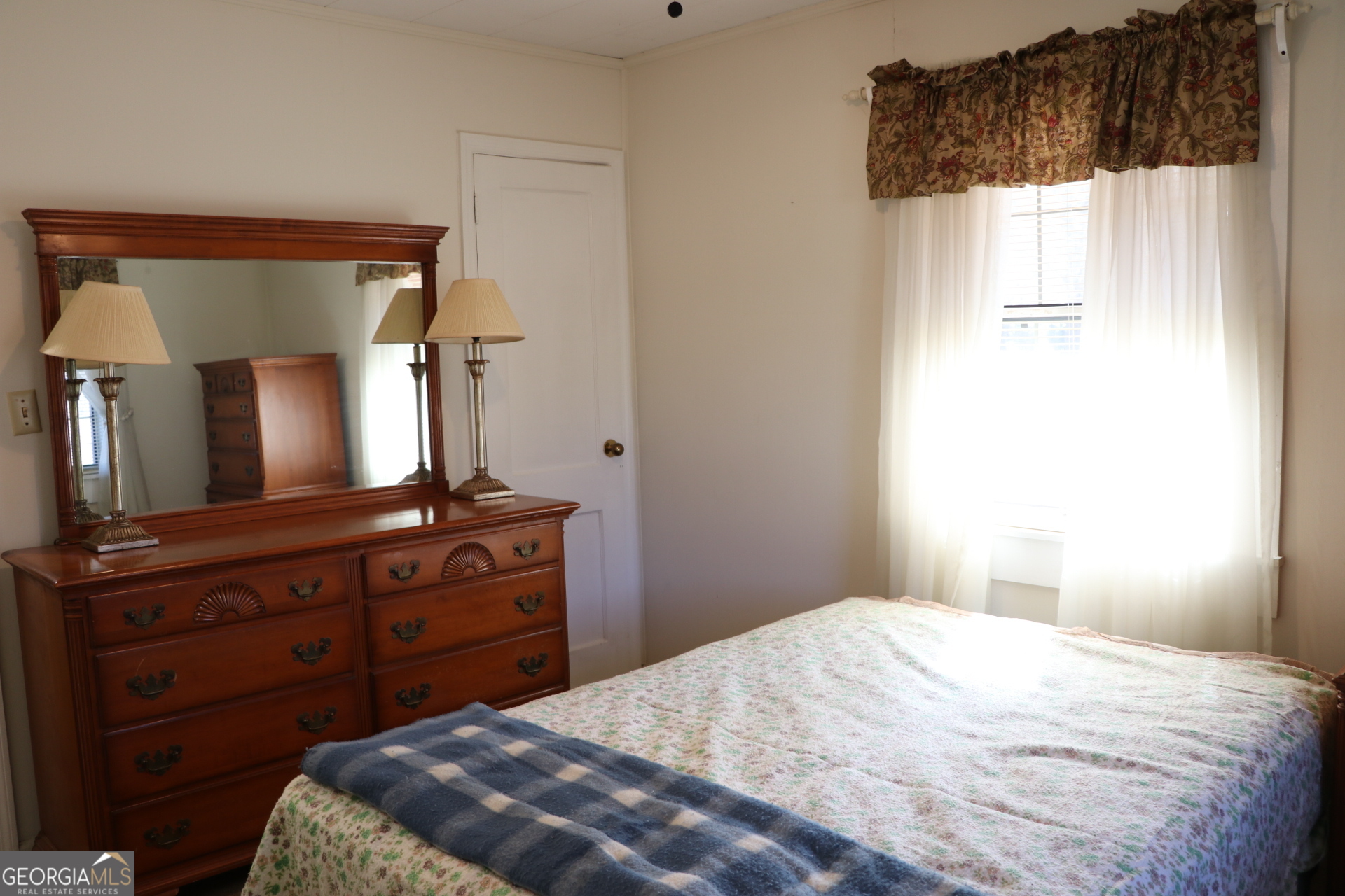 6797 Highway 114 Lyerly, GA 30730 - Photo 45 of 56 a bedroom with a bed and a mirror on dresser