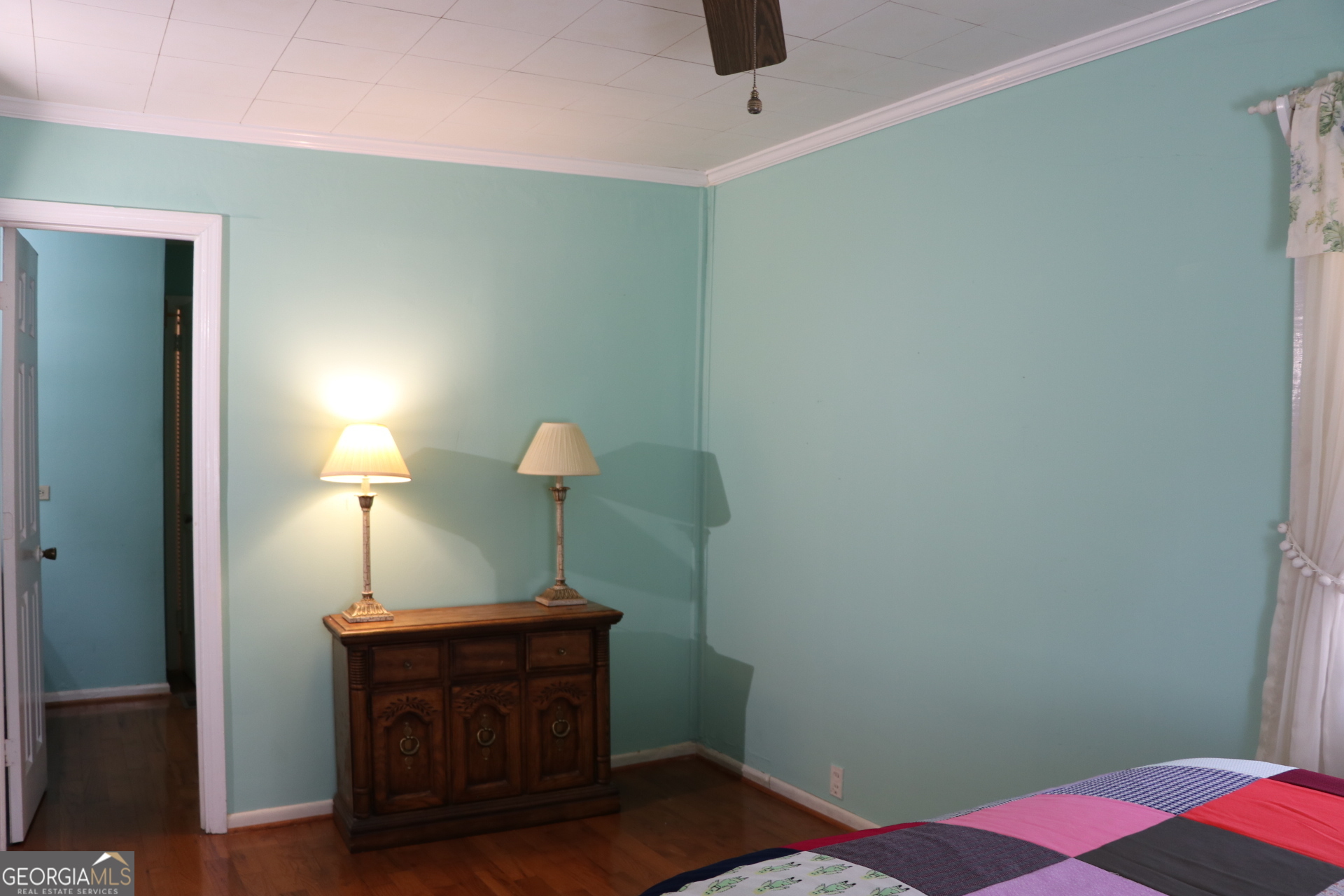 6797 Highway 114 Lyerly, GA 30730 - Photo 48 of 56 a bedroom with a bed and a lamp on the dresser