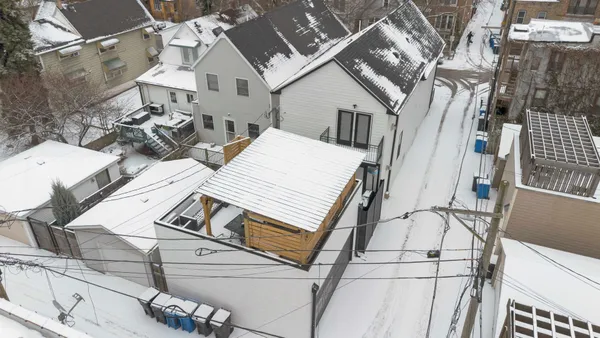 a view of a white building with many windows