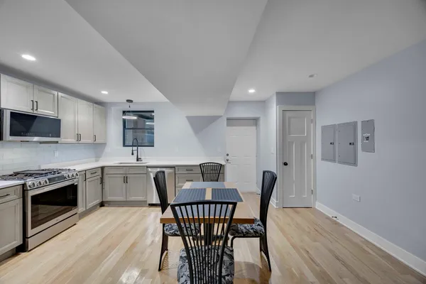 a view of a dining room with furniture and wooden floor