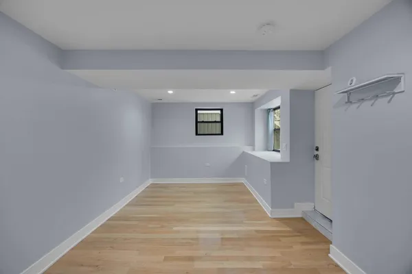 a view of room with window and hardwood floor