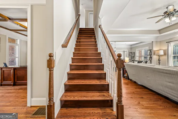 a kitchen with stainless steel appliances granite countertop wooden cabinets a stove top oven a sink and dishwasher