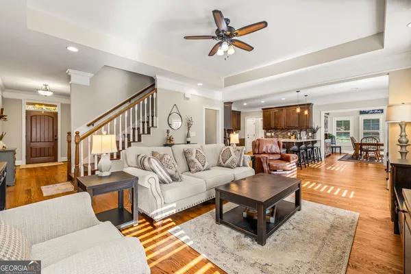 a kitchen with stainless steel appliances granite countertop a refrigerator stove and sink