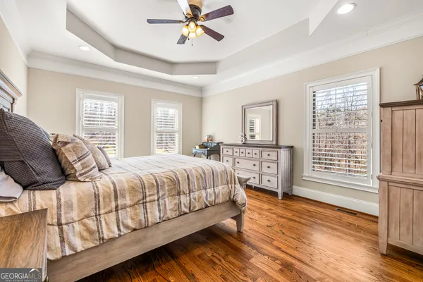 a view of an empty room and wooden floor