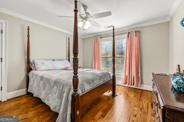 a view of a storage room with wooden floor