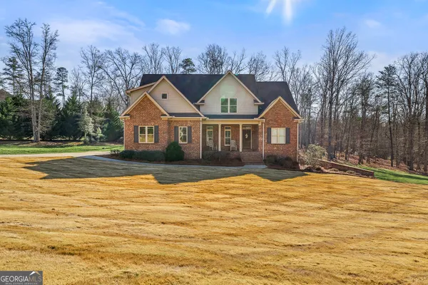 a front view of a house with a yard