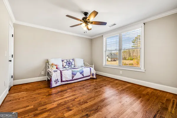 a view of a livingroom with furniture and a window