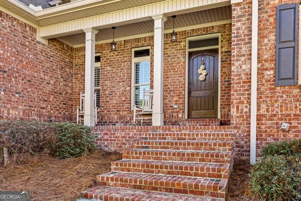 a view of a livingroom with furniture and wooden floor