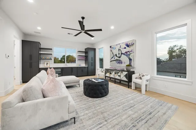 a bathroom with a tub sink shower and mirror