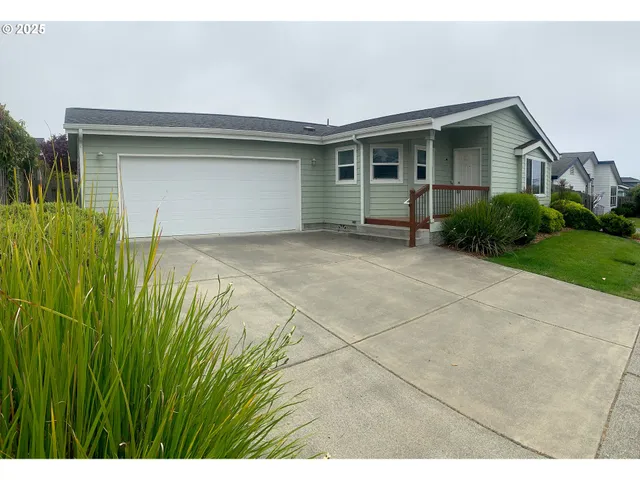 a view of backyard of house with green space