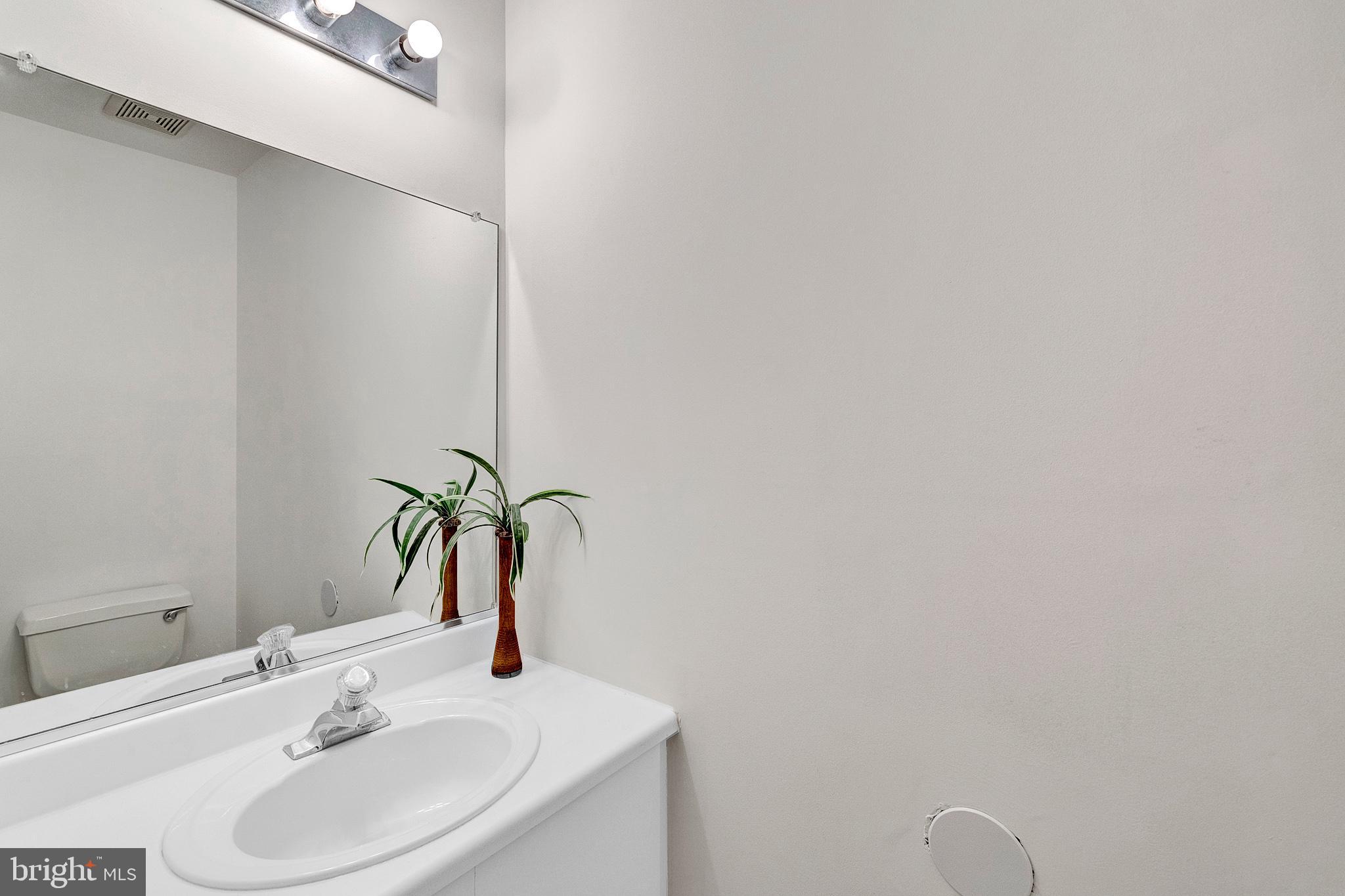 305 Deer Run Court Pennington, NJ 08534 - Photo 19 of 34 a bathroom with a sink and a mirror