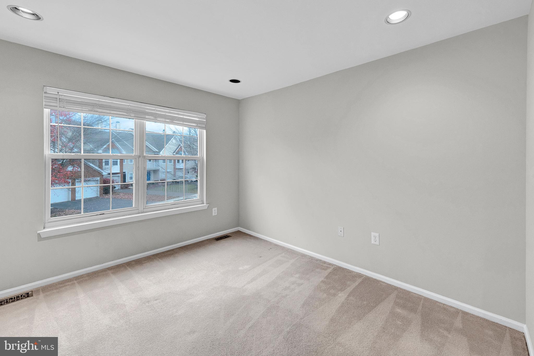 305 Deer Run Court Pennington, NJ 08534 - Photo 24 of 34 a view of an empty room with a window