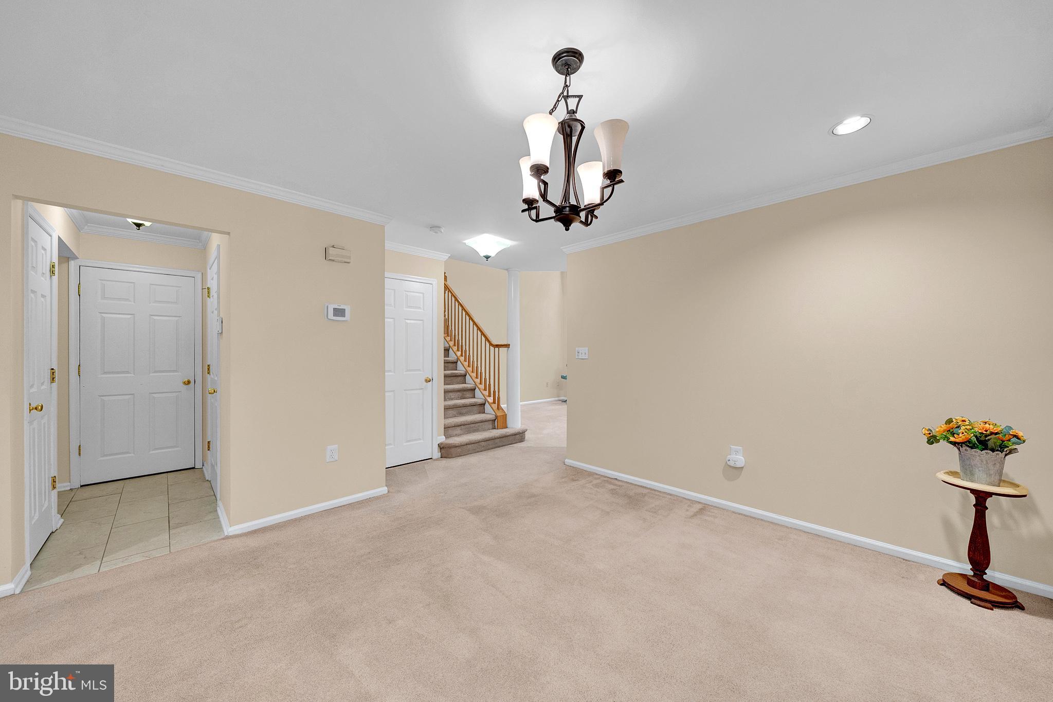305 Deer Run Court Pennington, NJ 08534 - Photo 6 of 34 a view of a room with a hanging light and kitchen space