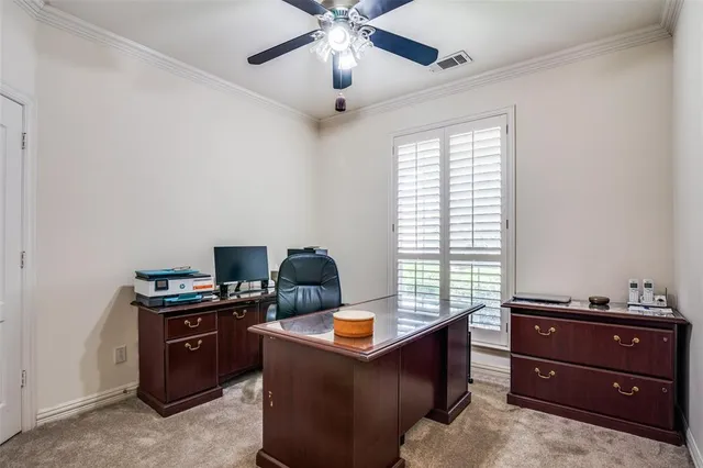 a room with a window and a dresser