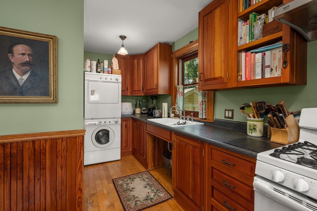 14 Summer Street Andover, MA 01810 - Photo 11 of 31 a kitchen with a stove a sink and a refrigerator