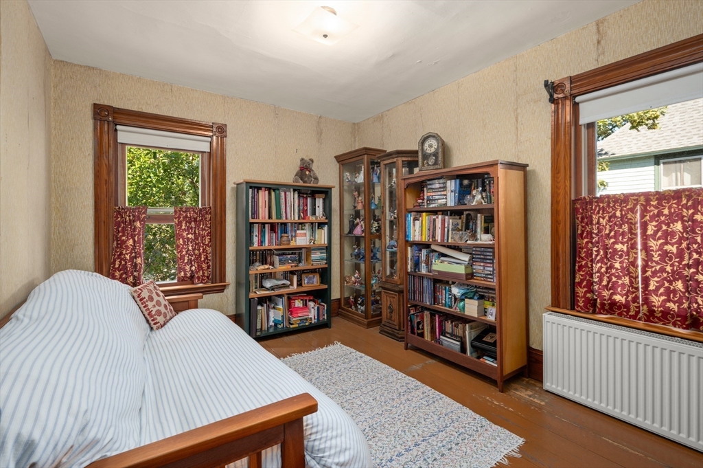 14 Summer Street Andover, MA 01810 - Photo 17 of 31 a living room with lots of furniture and book shelf