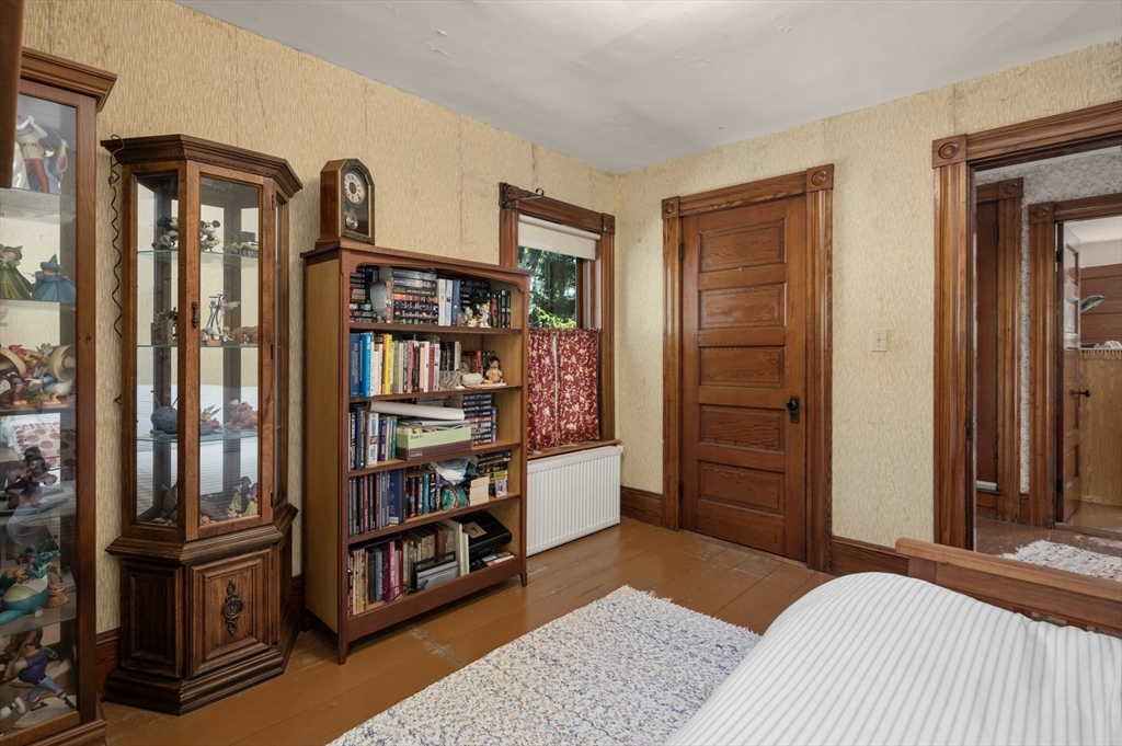 14 Summer Street Andover, MA 01810 - Photo 19 of 31 a bedroom with furniture and baby crib