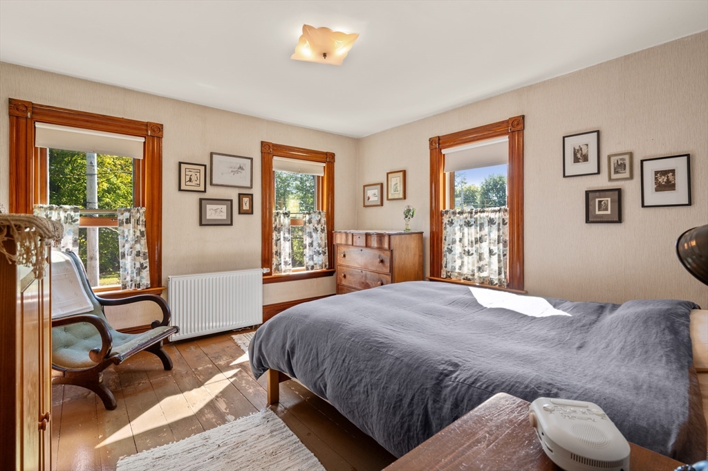14 Summer Street Andover, MA 01810 - Photo 21 of 31 a bedroom with a bed and wooden floor