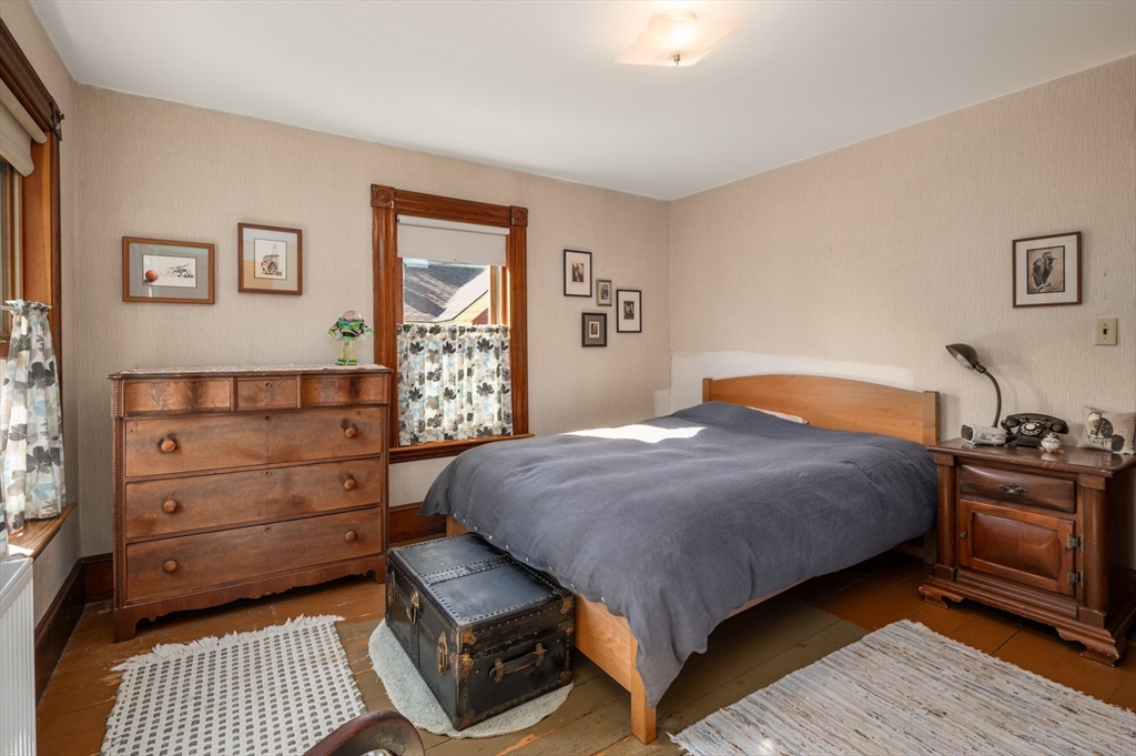 14 Summer Street Andover, MA 01810 - Photo 22 of 31 a bedroom with a bed and wooden floor