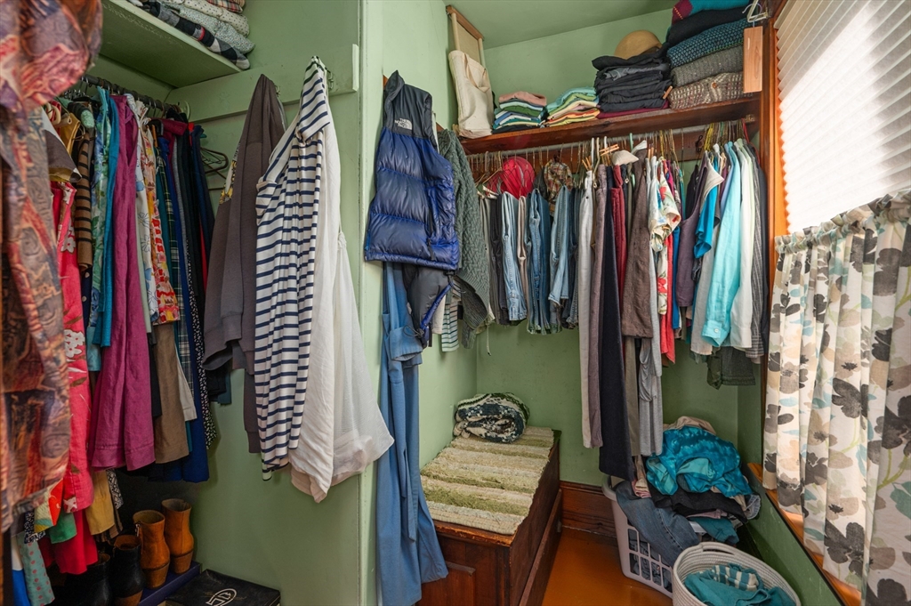14 Summer Street Andover, MA 01810 - Photo 23 of 31 a view of walk in closet with clothes and shoes