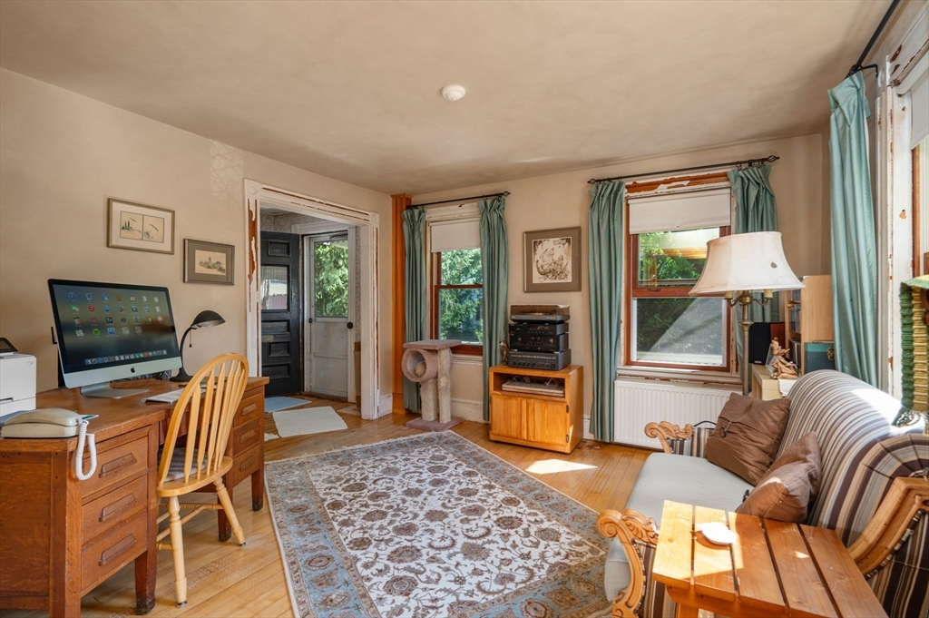 14 Summer Street Andover, MA 01810 - Photo 7 of 31 a living room with furniture and a flat screen tv