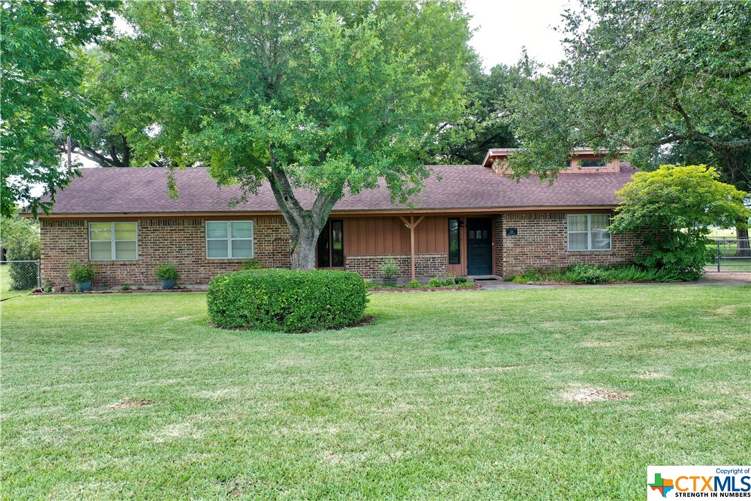138 Russell Road Victoria, TX 77904 - Photo 1 of 1 a front view of a house with a yard and trees