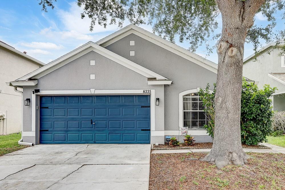 8335 Crescent Moon Drive New Port Richey, FL 34655 - Photo 1 of 1 a front view of a house with a yard and garage