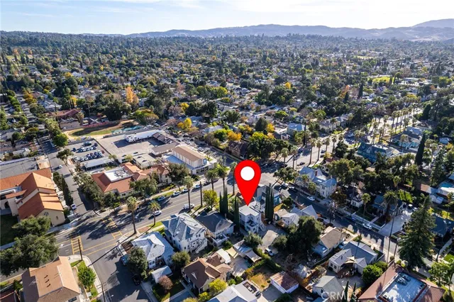 an aerial view of city and mountain