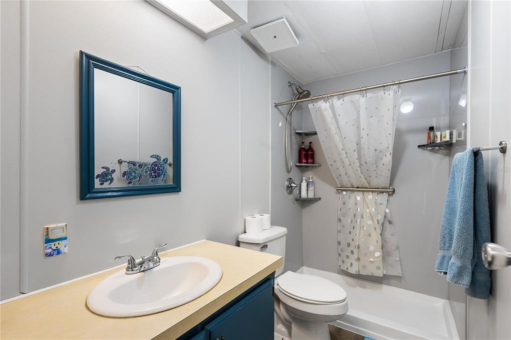 26 Da-Rosa Avenue DeBary, FL 32713 - Photo 19 of 45 a bathroom with a sink toilet and a mirror