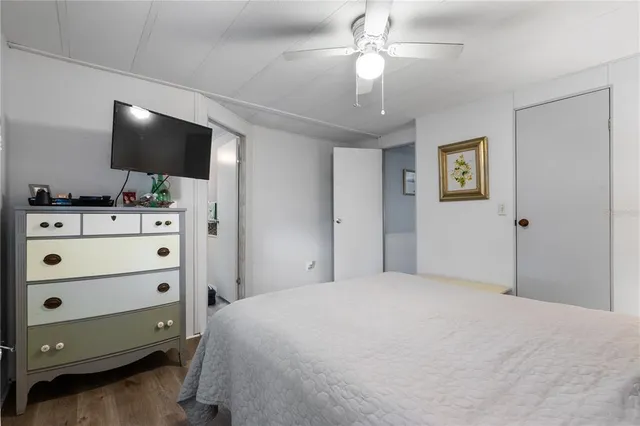 a bedroom with a bed and lamps