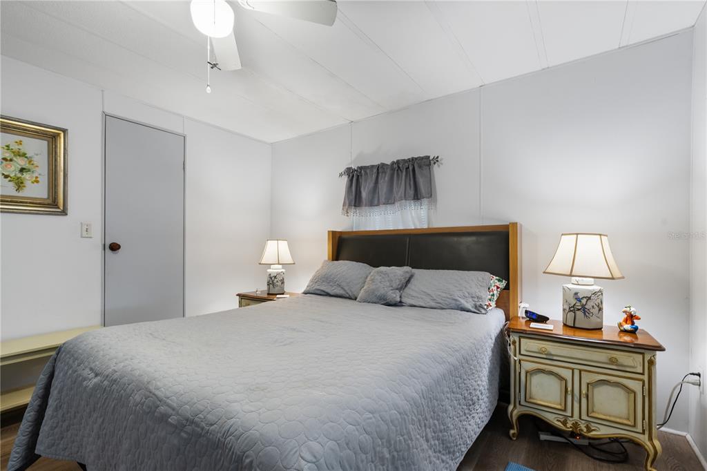 26 Da-Rosa Avenue DeBary, FL 32713 - Photo 21 of 45 a bedroom with a bed and lamps