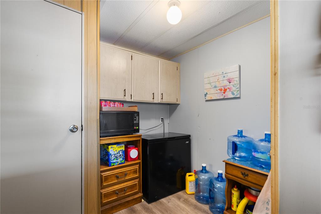 26 Da-Rosa Avenue DeBary, FL 32713 - Photo 23 of 45 a view of hallway with washer and dryer