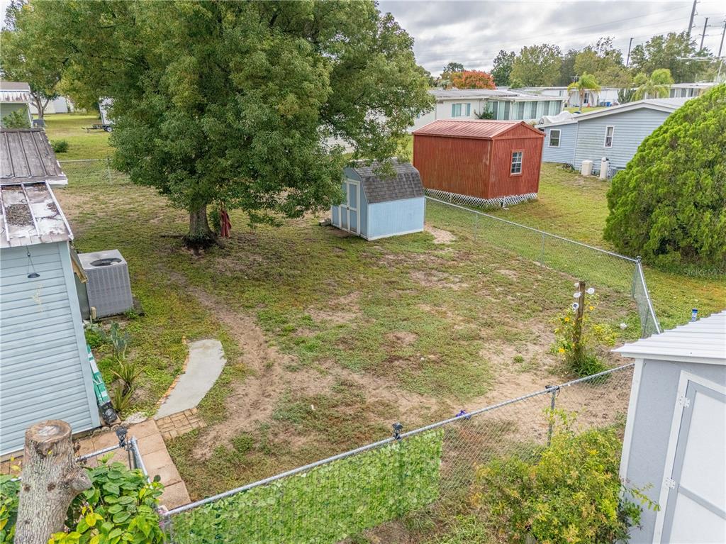 26 Da-Rosa Avenue DeBary, FL 32713 - Photo 26 of 45 a backyard of a house with table and chairs