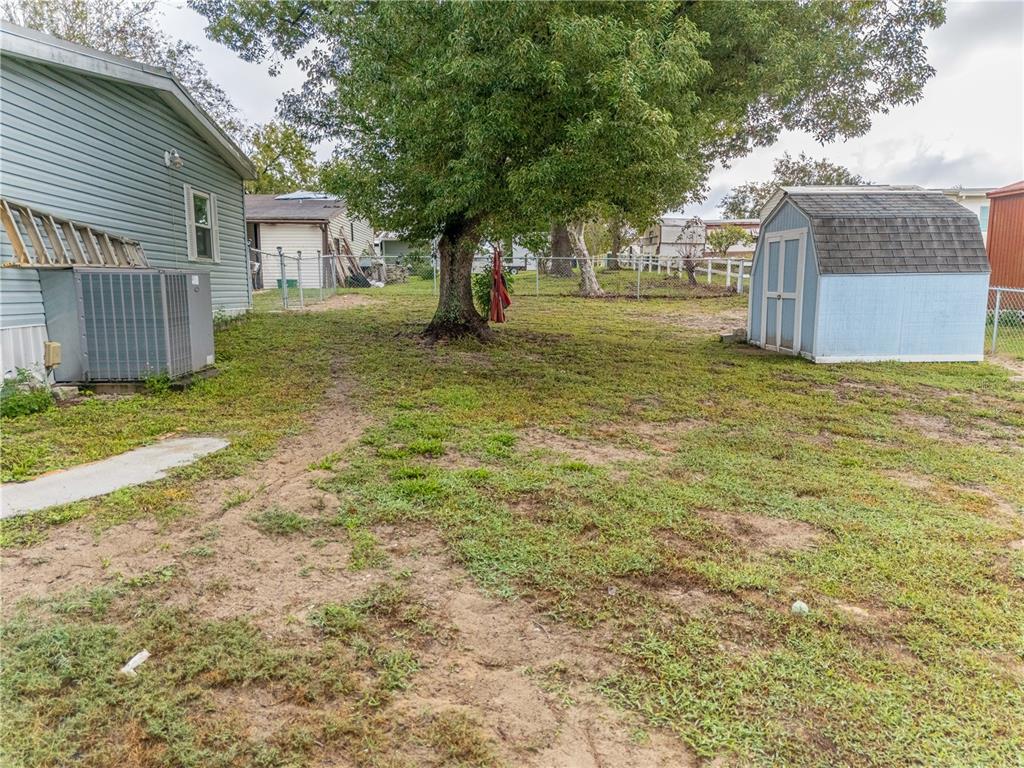 26 Da-Rosa Avenue DeBary, FL 32713 - Photo 28 of 45 a view of a yard with a house and a tree