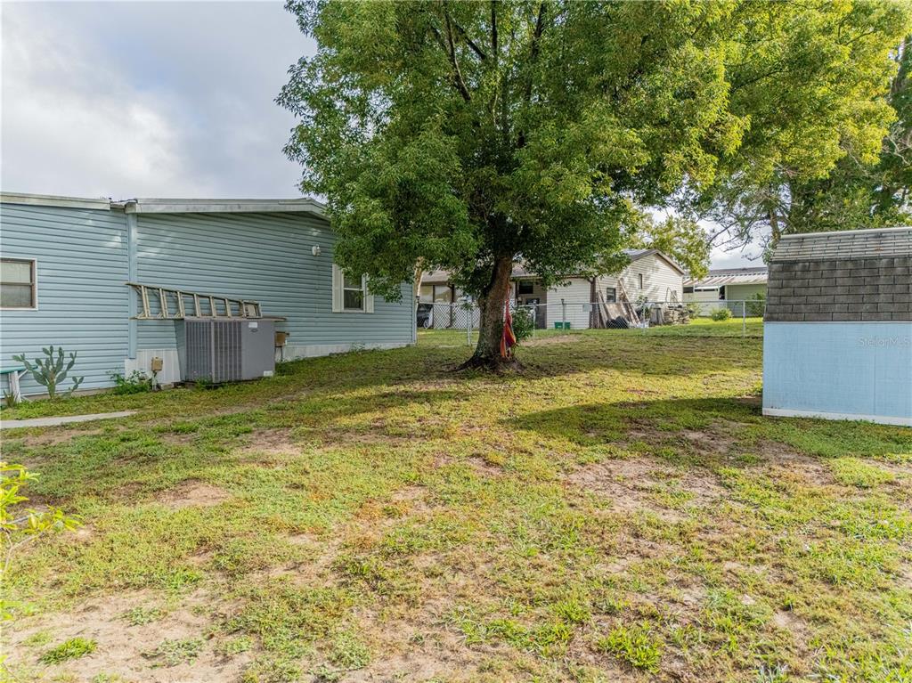 26 Da-Rosa Avenue DeBary, FL 32713 - Photo 29 of 45 a view of a house with a yard