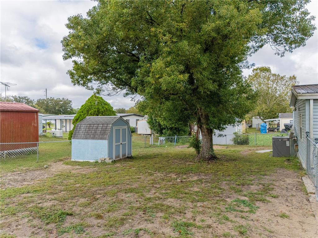 26 Da-Rosa Avenue DeBary, FL 32713 - Photo 31 of 45 a view of a house with a yard