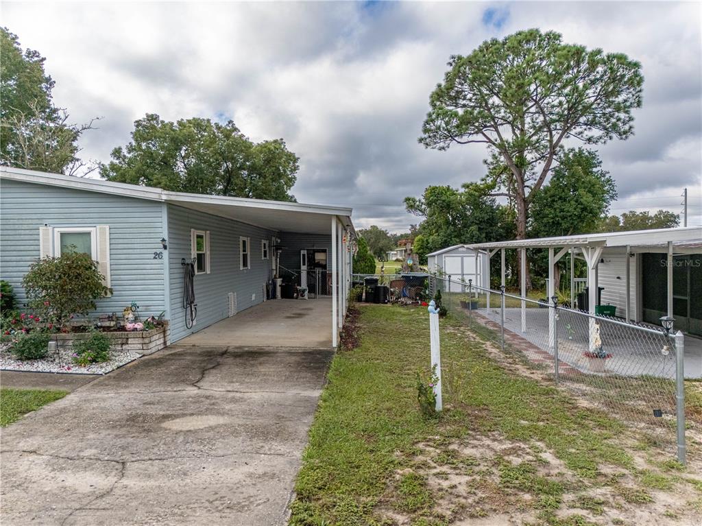26 Da-Rosa Avenue DeBary, FL 32713 - Photo 38 of 45 a view of a house with backyard porch and sitting area
