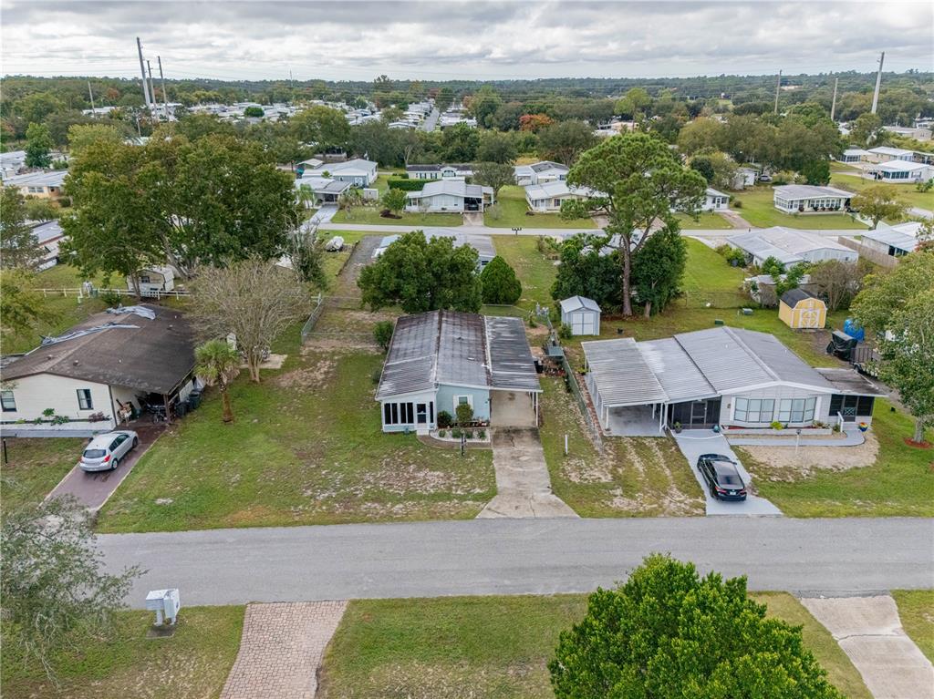 26 Da-Rosa Avenue DeBary, FL 32713 - Photo 39 of 45 an aerial view of residential houses with outdoor space and parking