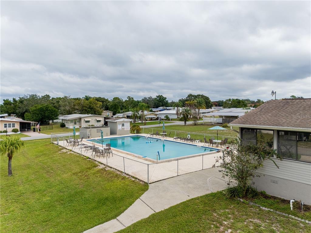 26 Da-Rosa Avenue DeBary, FL 32713 - Photo 45 of 45 a view of a swimming pool with lawn chairs