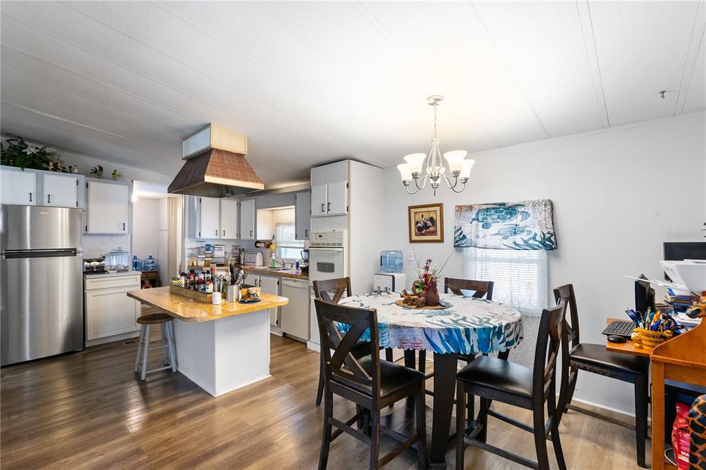 26 Da-Rosa Avenue DeBary, FL 32713 - Photo 6 of 45 a view of a dining room with furniture window and wooden floor