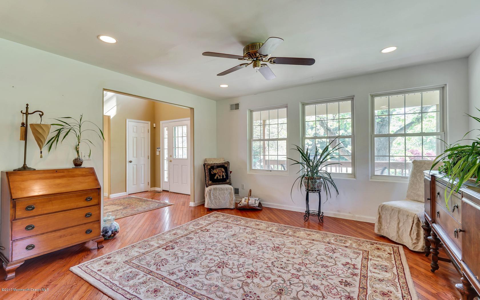 460 North County Line Road Jackson, NJ 08527 - Photo 16 of 48 a living room with furniture and a dining table