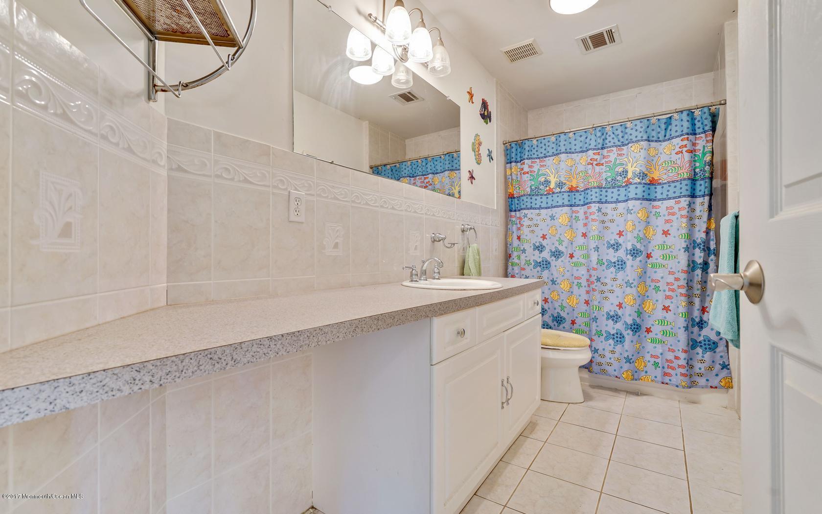 460 North County Line Road Jackson, NJ 08527 - Photo 29 of 48 a bathroom with a sink toilet and shower