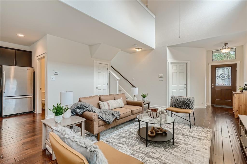 2101 Rivers Edge Way, Unit 19 Austin, TX 78741 - Photo 7 of 24 a living room with furniture and wooden floor