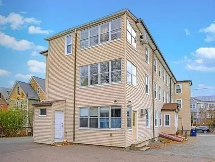 a front view of a house with a street