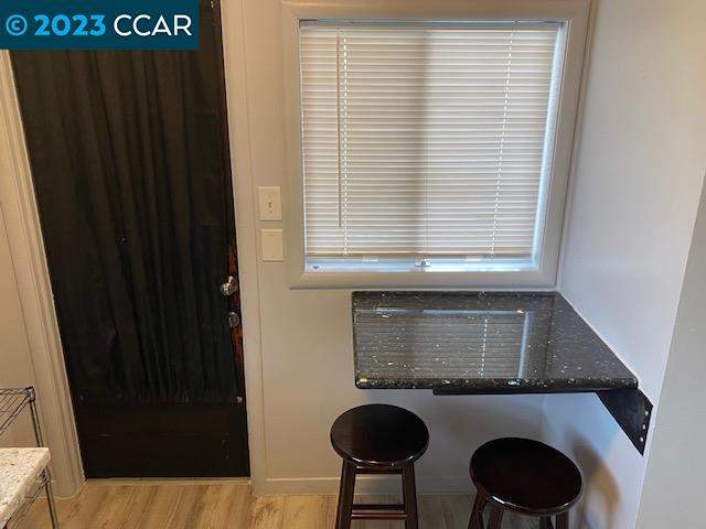 514 Talbot Avenue, Unit 514B Albany, CA 94706 - Photo 4 of 12 a kitchen with windows and table