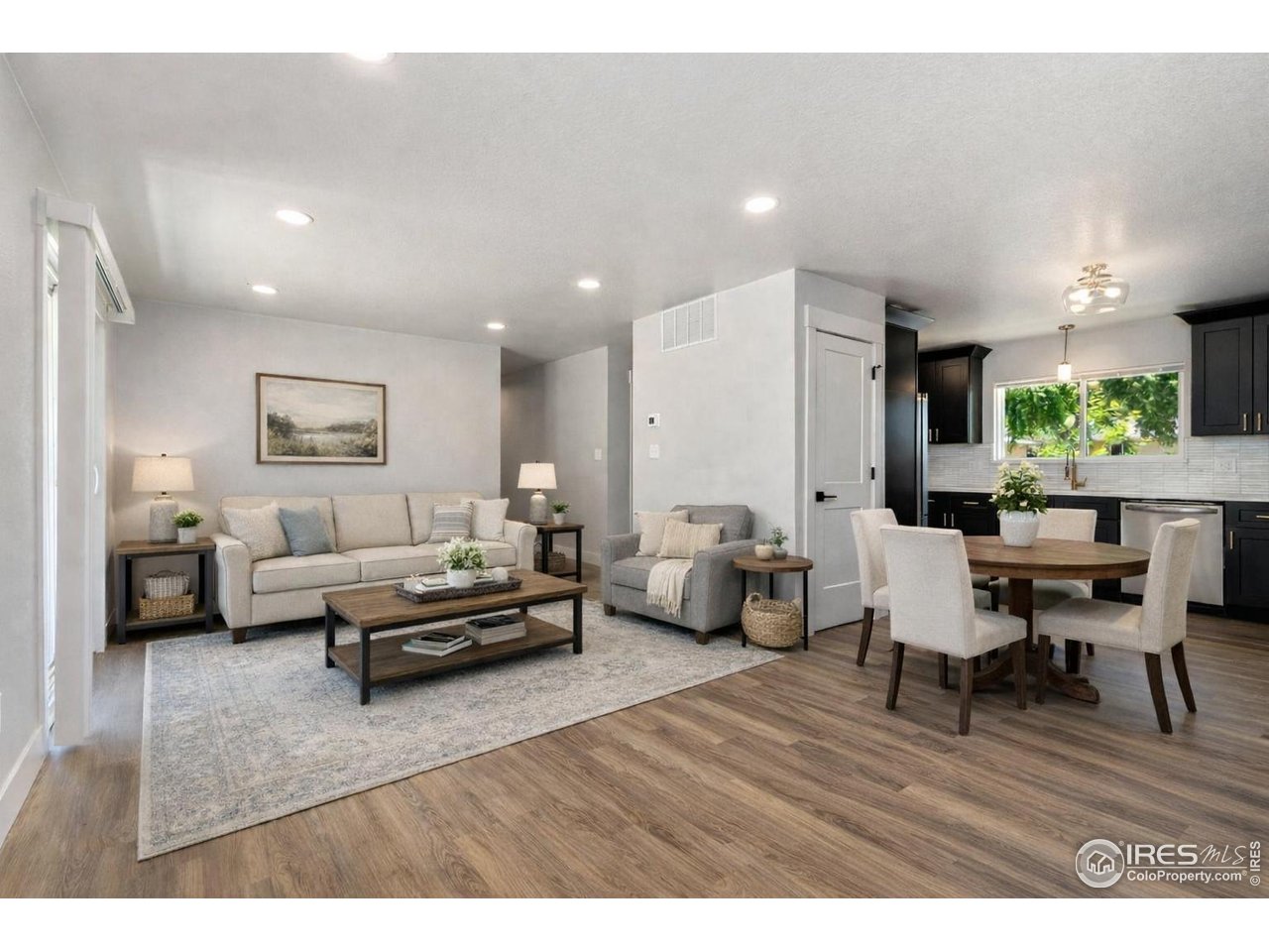 812 Rocky Road Fort Collins, CO 80521 - Photo 6 of 19 a living room with furniture and a wooden floor