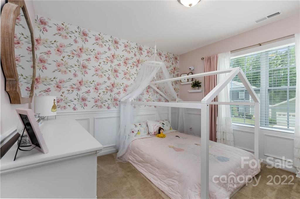 1563 Spring Blossom Trail Fort Mill, SC 29708 - Photo 18 of 25 a bed room with a bed and a window