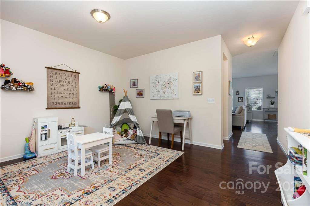 1563 Spring Blossom Trail Fort Mill, SC 29708 - Photo 10 of 25 a living room with furniture and a wooden floor