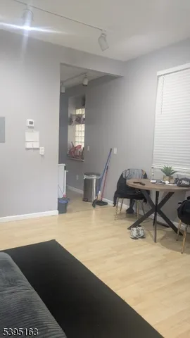 a view of a room with a table and chairs