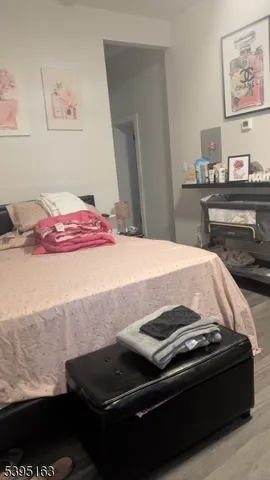 a bedroom with a bed and cabinets